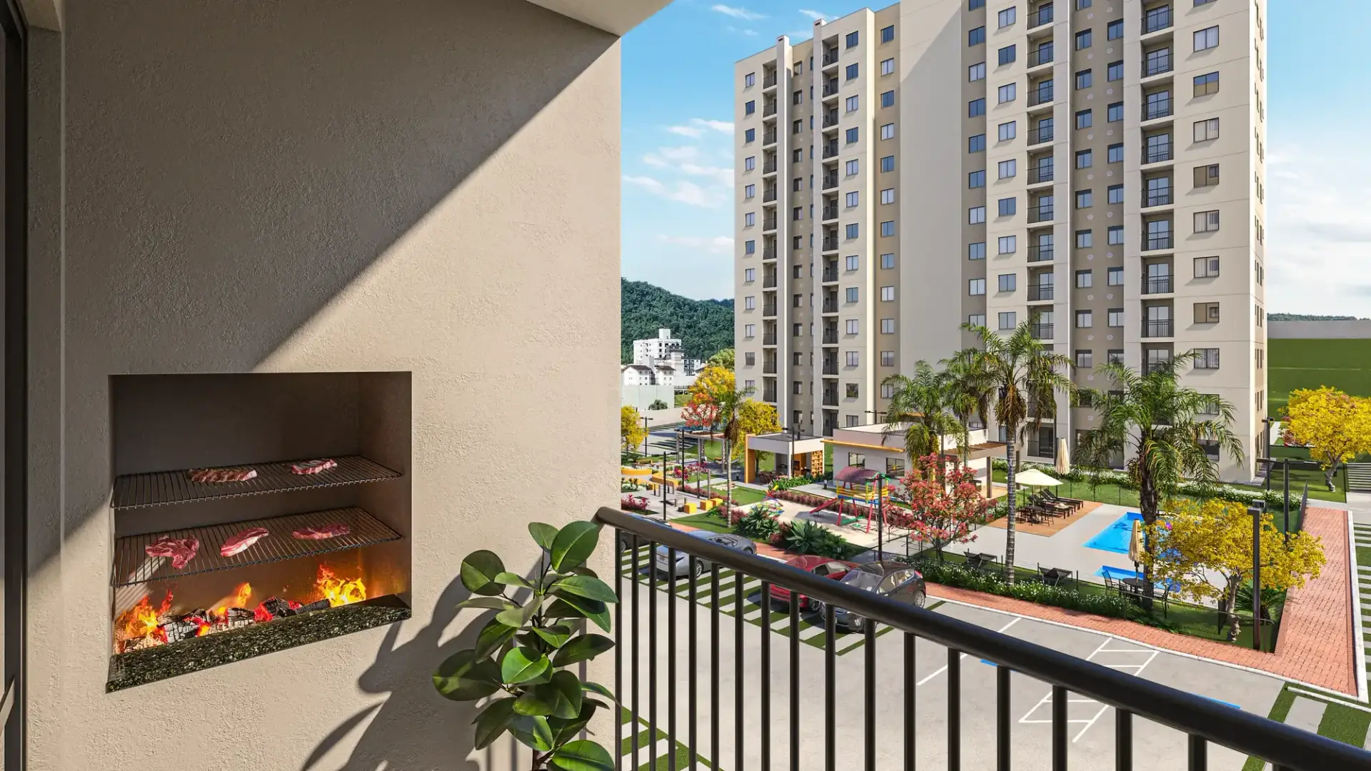 Sacada com churrasqueira do apartamento do VEGA Jaraguá, com vista para a área de lazer